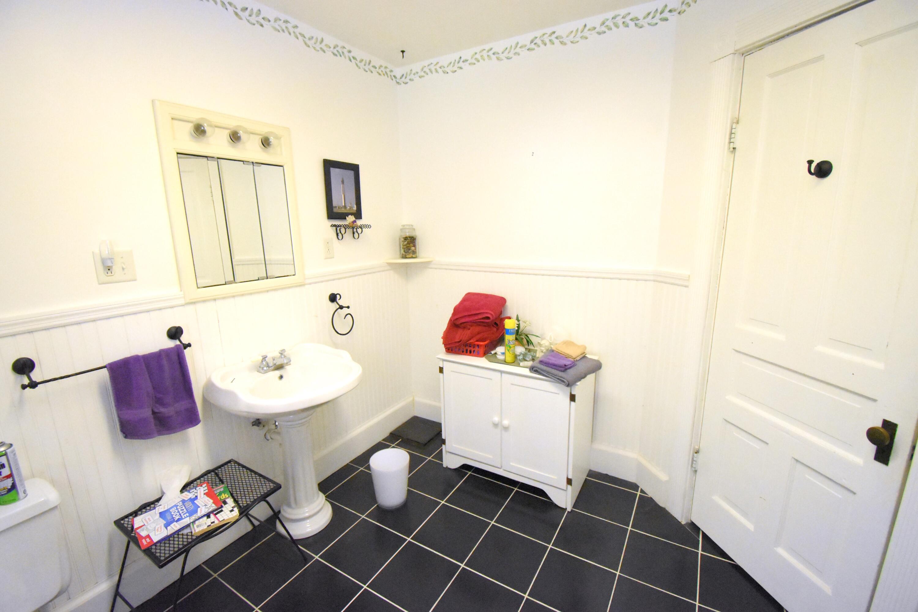 522 North Cullen Street Rensselaer, IN 47978 - Photo 31 of 43 a bathroom with a sink toilet and mirror