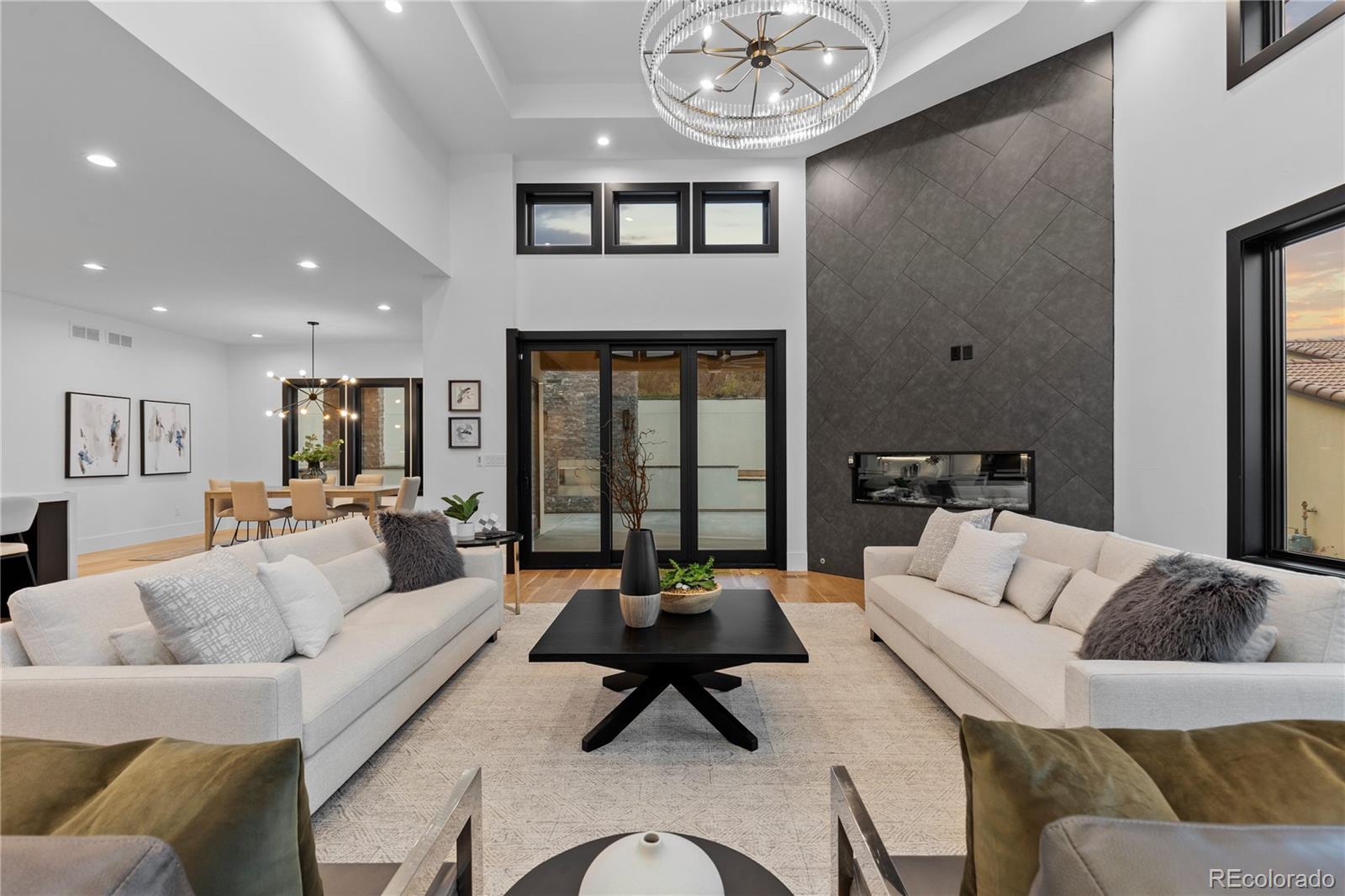 8103 Raphael Lane Littleton, CO 80125 - Photo 11 of 31 a living room with furniture or couch and a large window