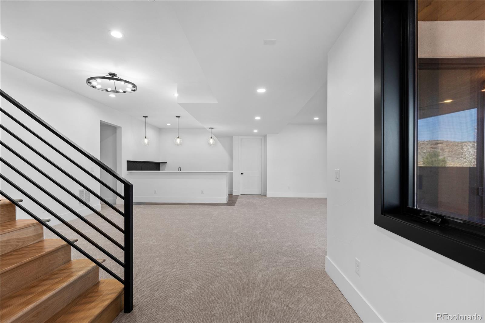 8103 Raphael Lane Littleton, CO 80125 - Photo 25 of 31 a view of a hallway with seating space