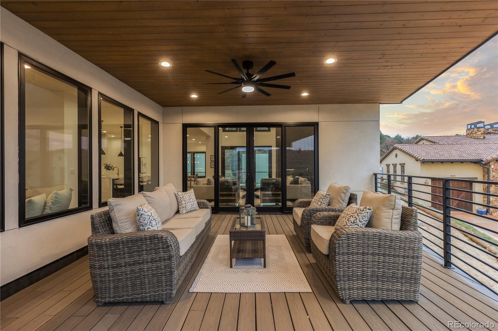 8103 Raphael Lane Littleton, CO 80125 - Photo 29 of 31 a living room with furniture and a large window