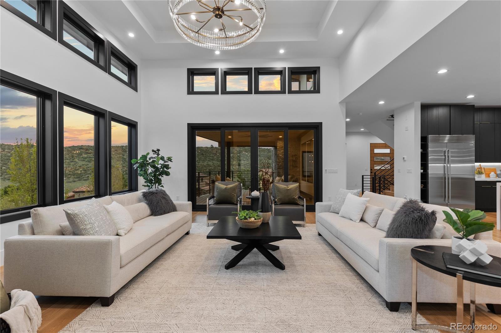 8103 Raphael Lane Littleton, CO 80125 - Photo 9 of 31 a living room with furniture and a large window