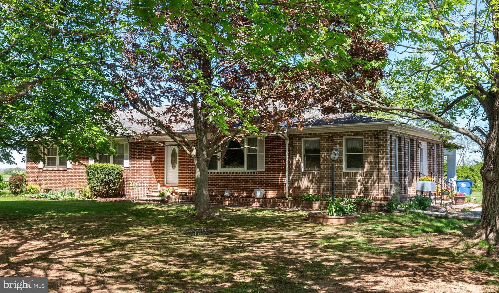 2226 Harney Road Littlestown, PA 17340 - Photo 3 of 113 a front view of a house with garden