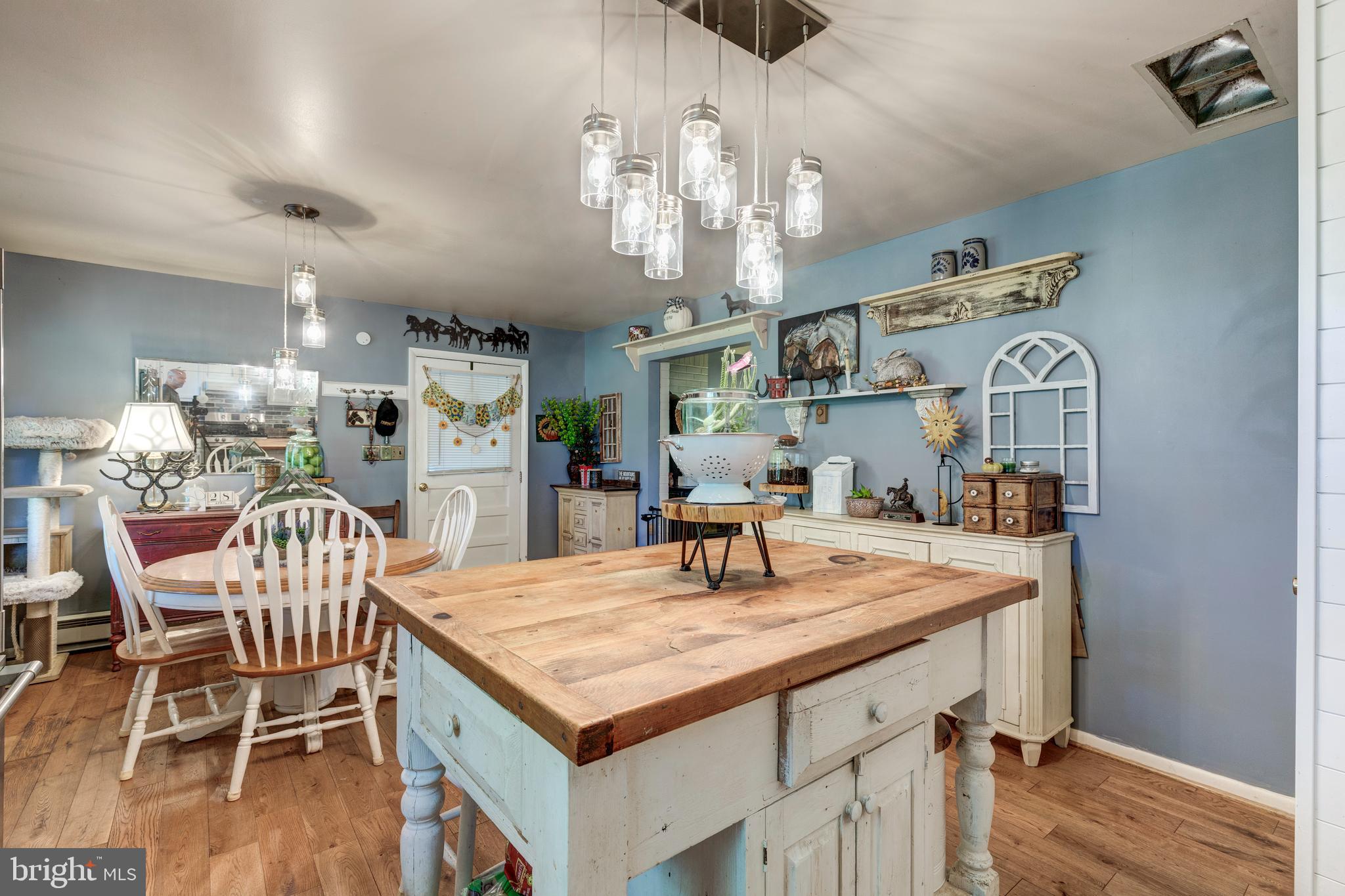 2226 Harney Road Littlestown, PA 17340 - Photo 31 of 113 a view of a dining room with furniture and wooden floor