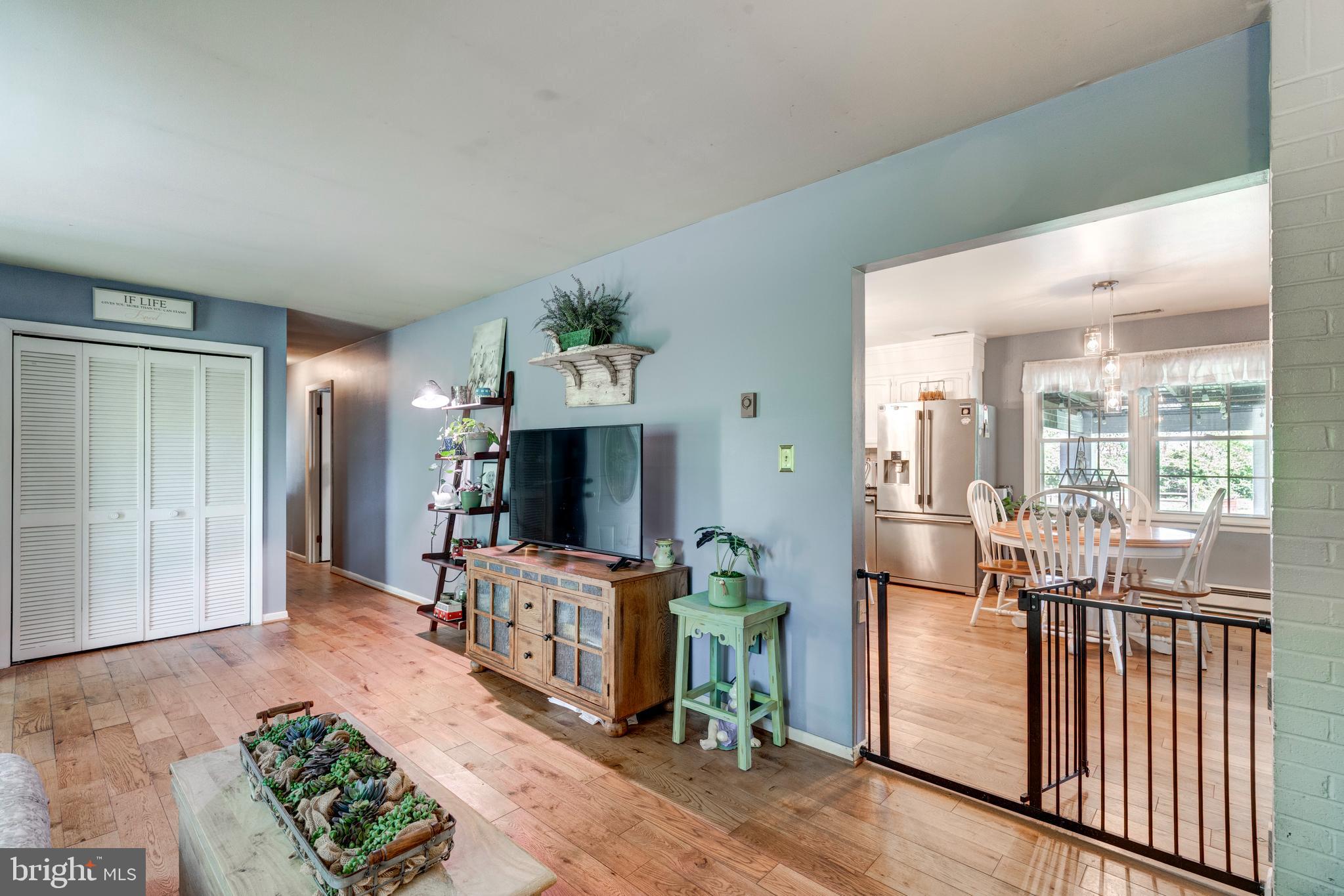 2226 Harney Road Littlestown, PA 17340 - Photo 38 of 113 a living room with furniture a flat screen tv and a fireplace