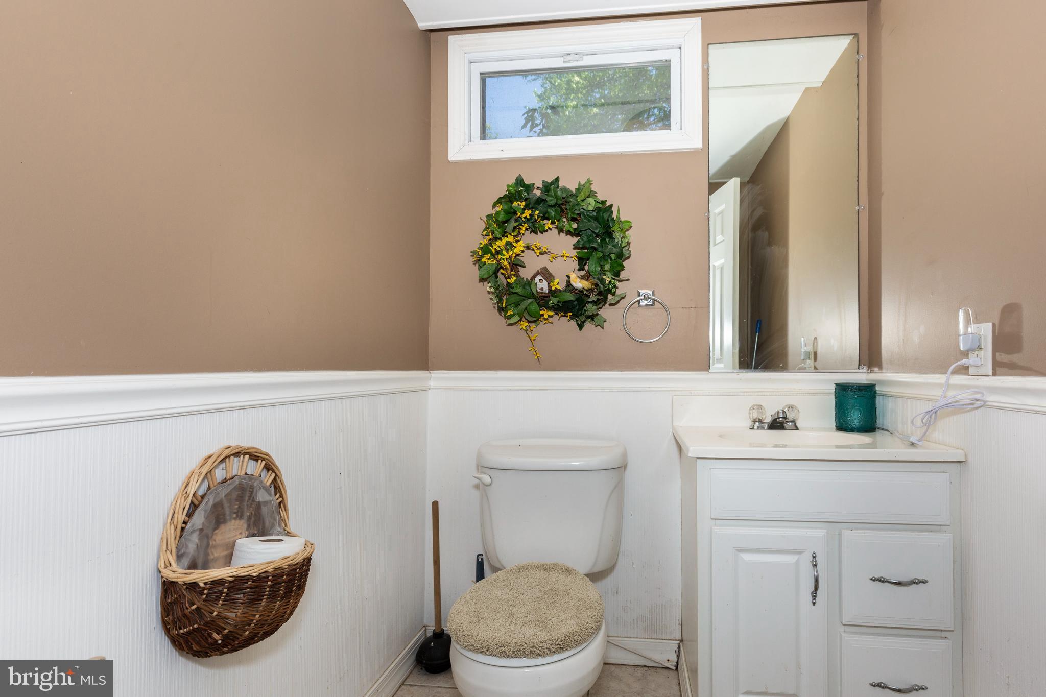 2226 Harney Road Littlestown, PA 17340 - Photo 61 of 113 a bathroom with a toilet a sink and mirror