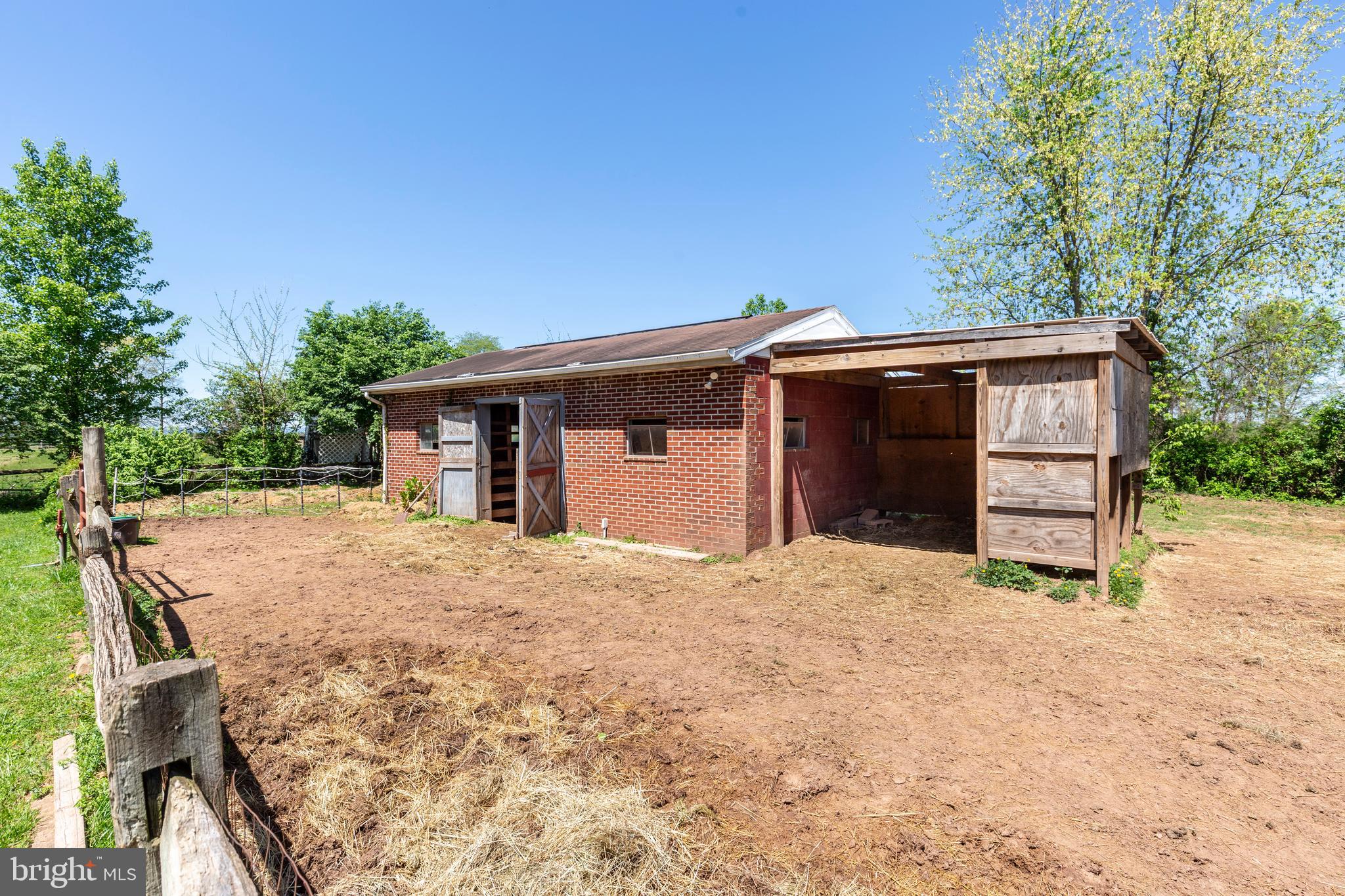 2226 Harney Road Littlestown, PA 17340 - Photo 75 of 113 a front view of a house with a yard and garage