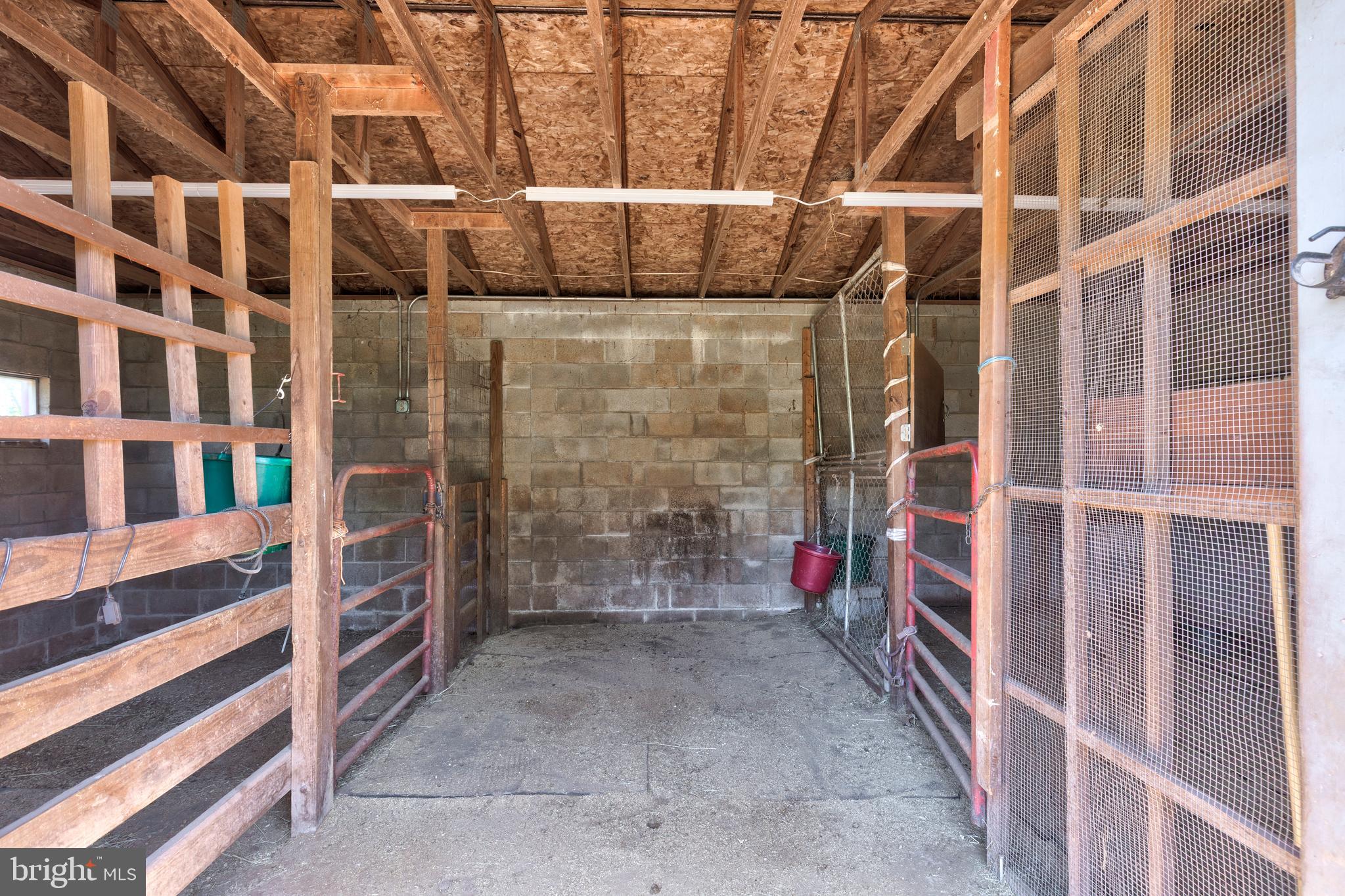 2226 Harney Road Littlestown, PA 17340 - Photo 79 of 113 a view of walk in closet with clothes and shoes