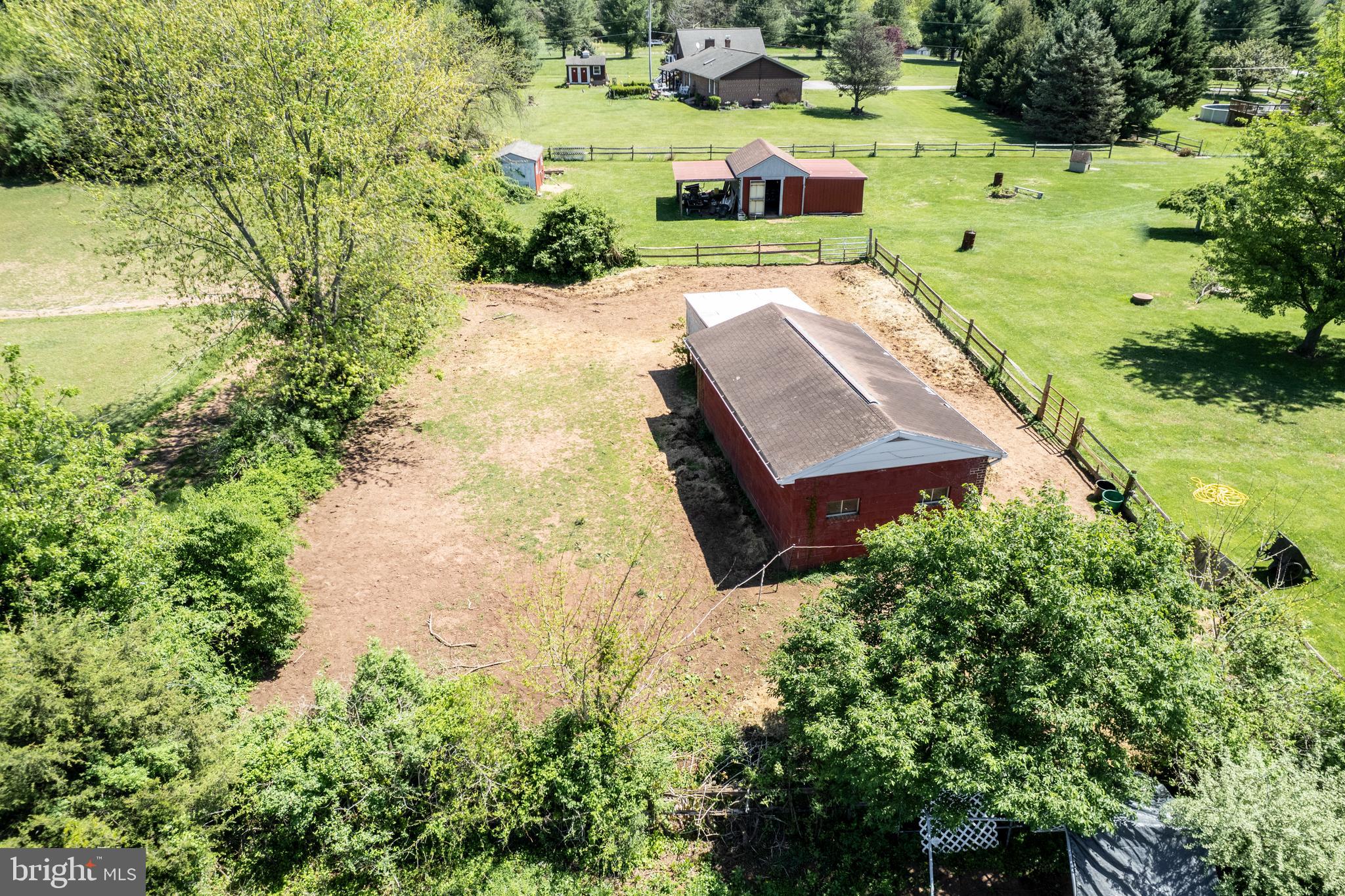 2226 Harney Road Littlestown, PA 17340 - Photo 96 of 113 an aerial view of a house with a yard lake lake and trees all around