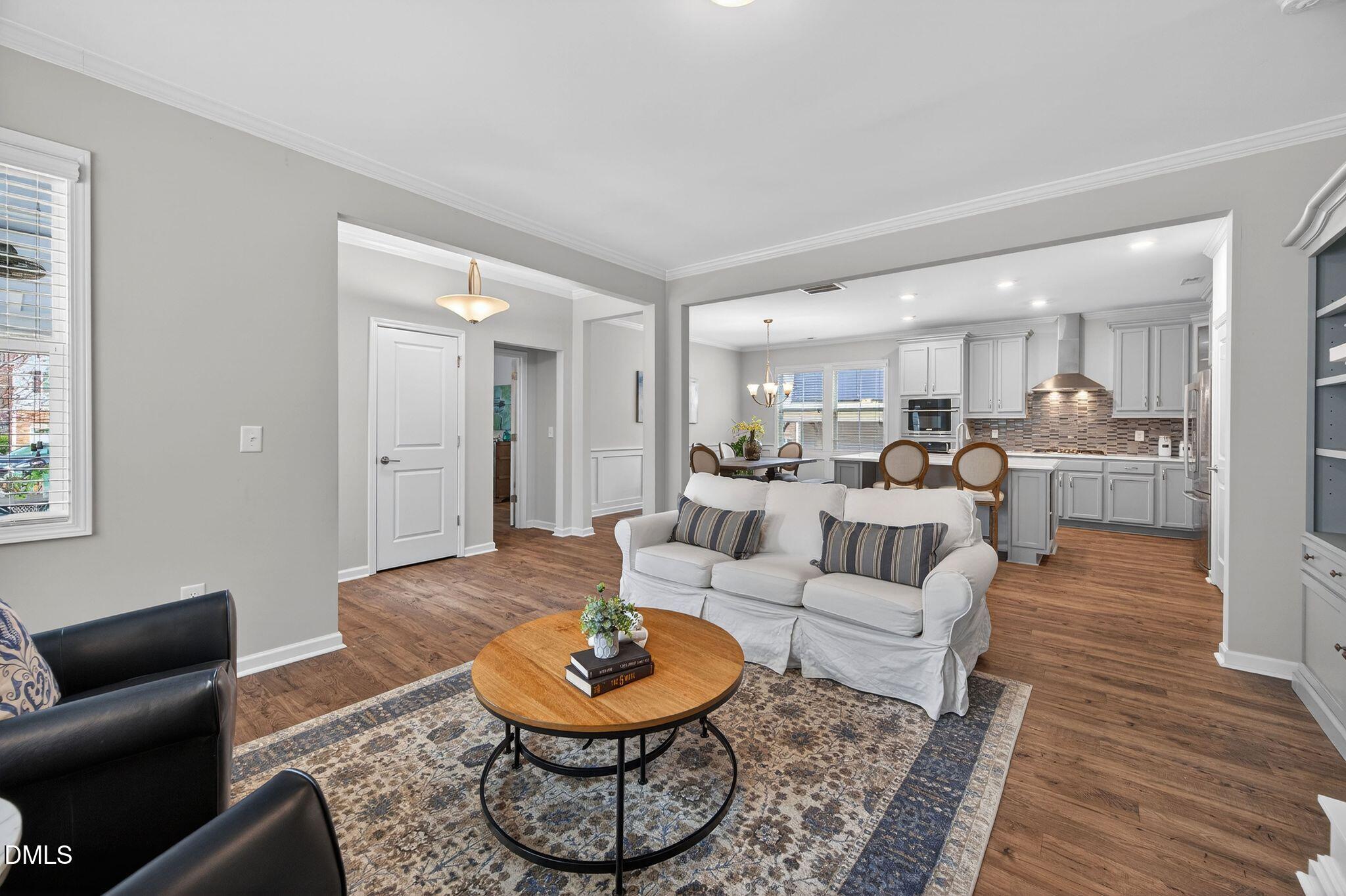 528 Spring Flower Court Cary, NC 27511 - Photo 11 of 51 Living Room open to Kitchen