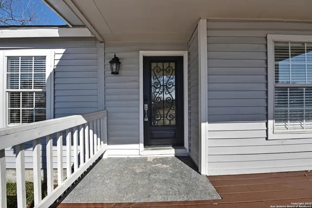 a view of a house with a door and a window