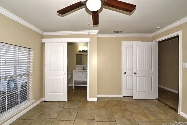 a view of a hallway with closet and a living room view
