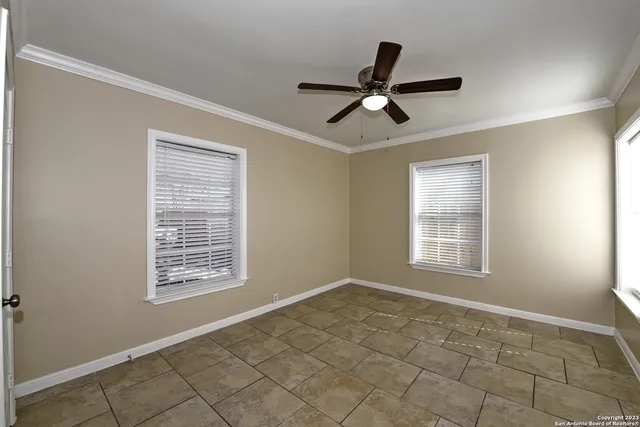 a view of an empty room and window