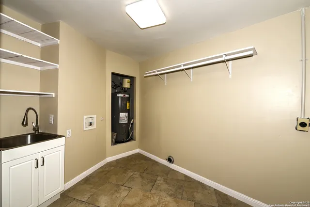 a view of a bathroom with a sink and a mirror