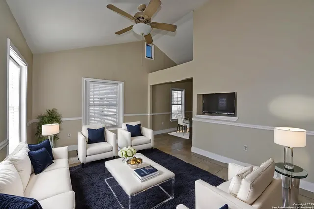 a living room with furniture and a flat screen tv