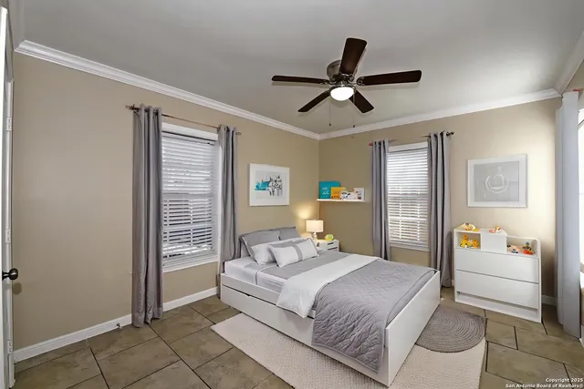 a bedroom with a bed and glass door