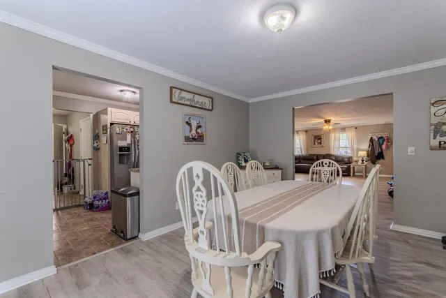a dining room with furniture and window