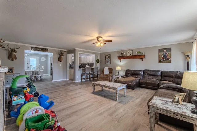 a bedroom with furniture and a wooden floor
