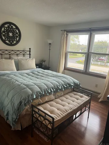 a bathroom with a toilet a sink and shower