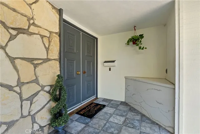 a view of an entryway with wooden floor