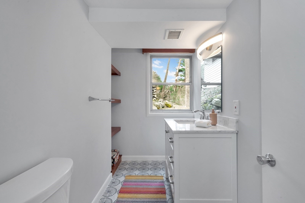 85 The Valley Road Concord, MA 01742 - Photo 29 of 38 a bathroom with a sink toilet and window