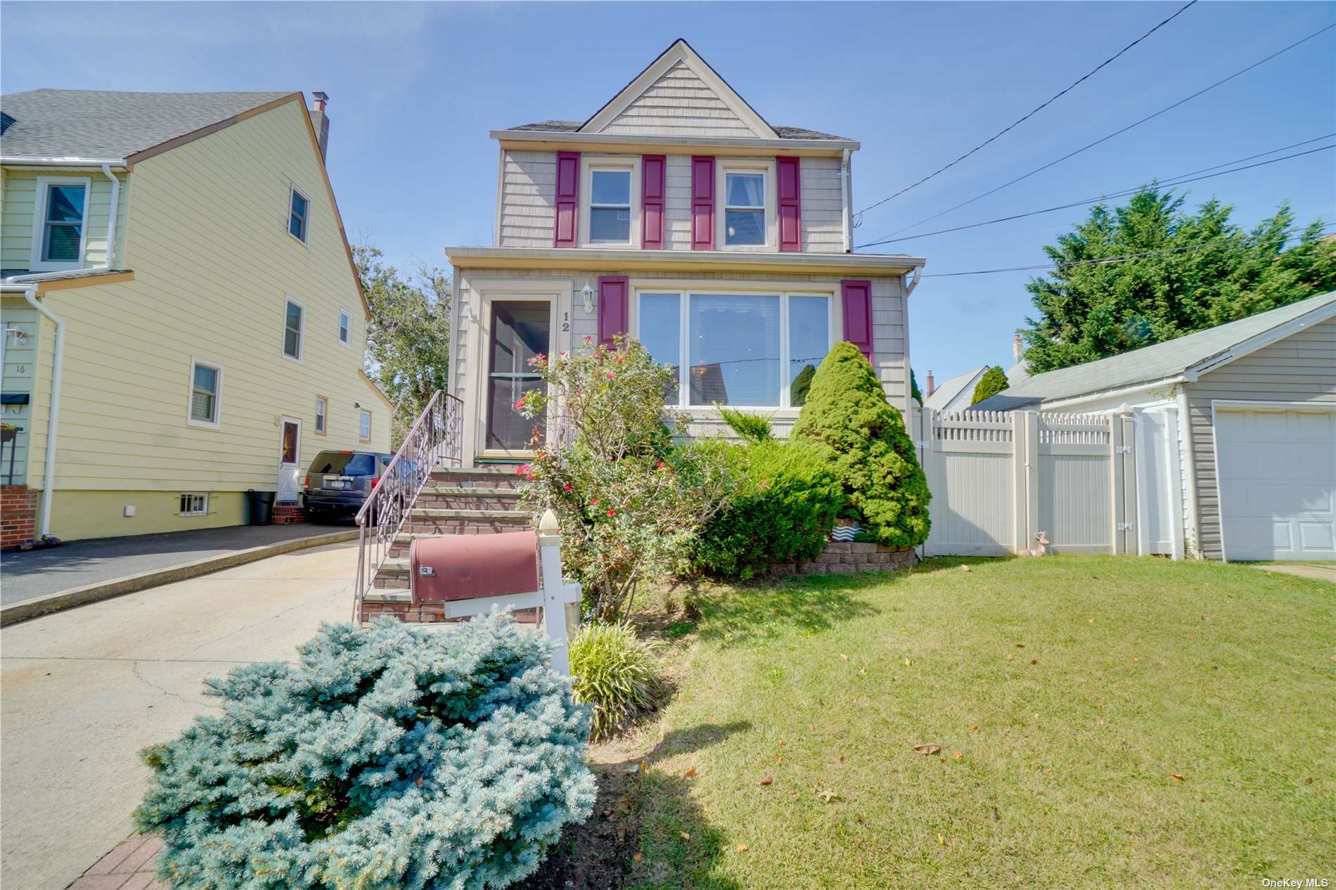 12 Marlboro Road Valley Stream, NY 11581 - Photo 1 of 1 a front view of a house with garden