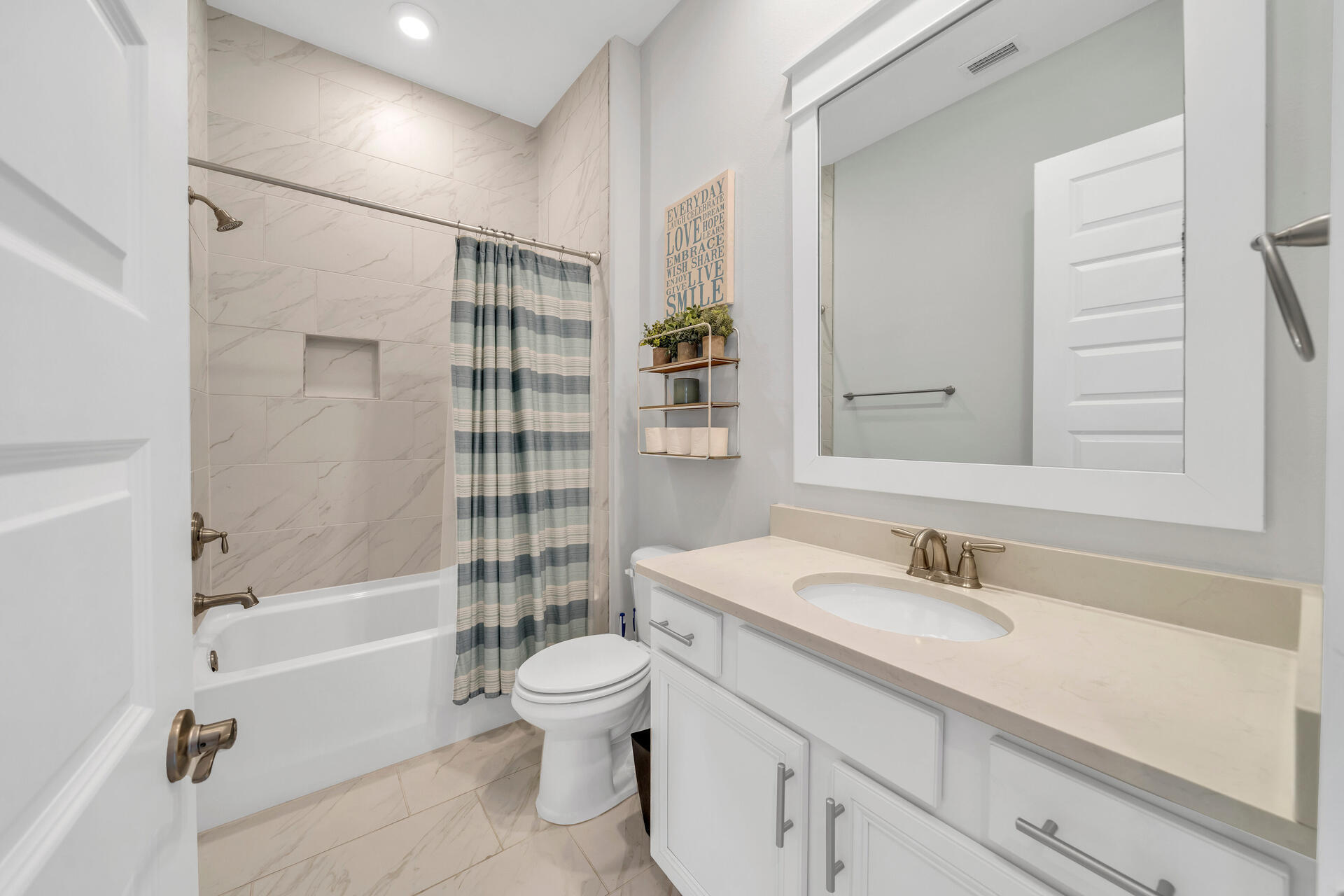 309 Milestone Dr Inlet Beach, Unit C Inlet Beach, FL 32461 - Photo 16 of 30 a bathroom with a sink a toilet and shower
