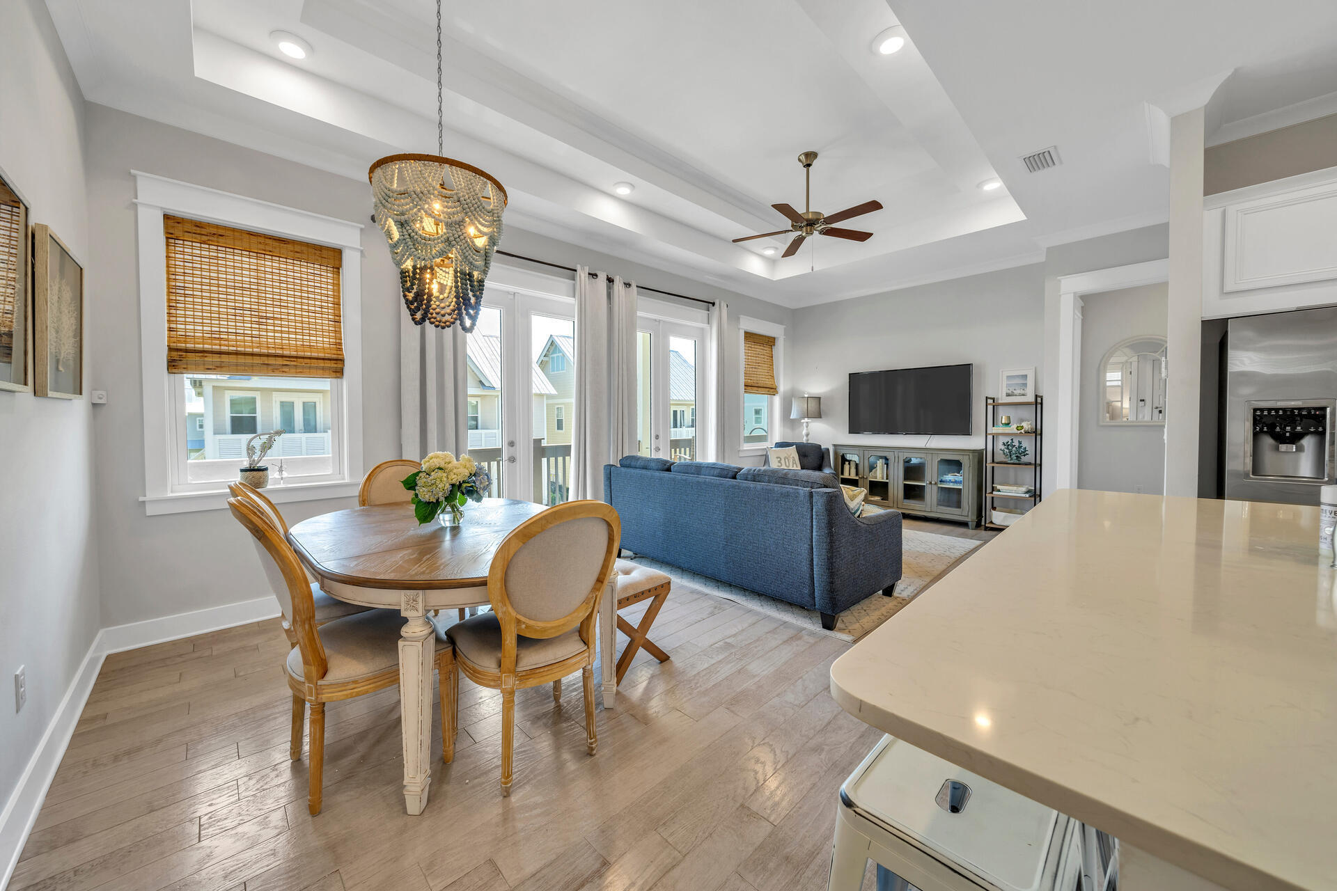 309 Milestone Dr Inlet Beach, Unit C Inlet Beach, FL 32461 - Photo 2 of 30 a view of a dining room with furniture a chandelier and wooden floor