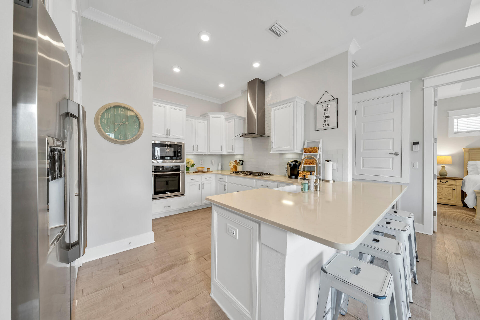 309 Milestone Dr Inlet Beach, Unit C Inlet Beach, FL 32461 - Photo 6 of 30 a large kitchen with stainless steel appliances granite countertop a sink a stove and a refrigerator