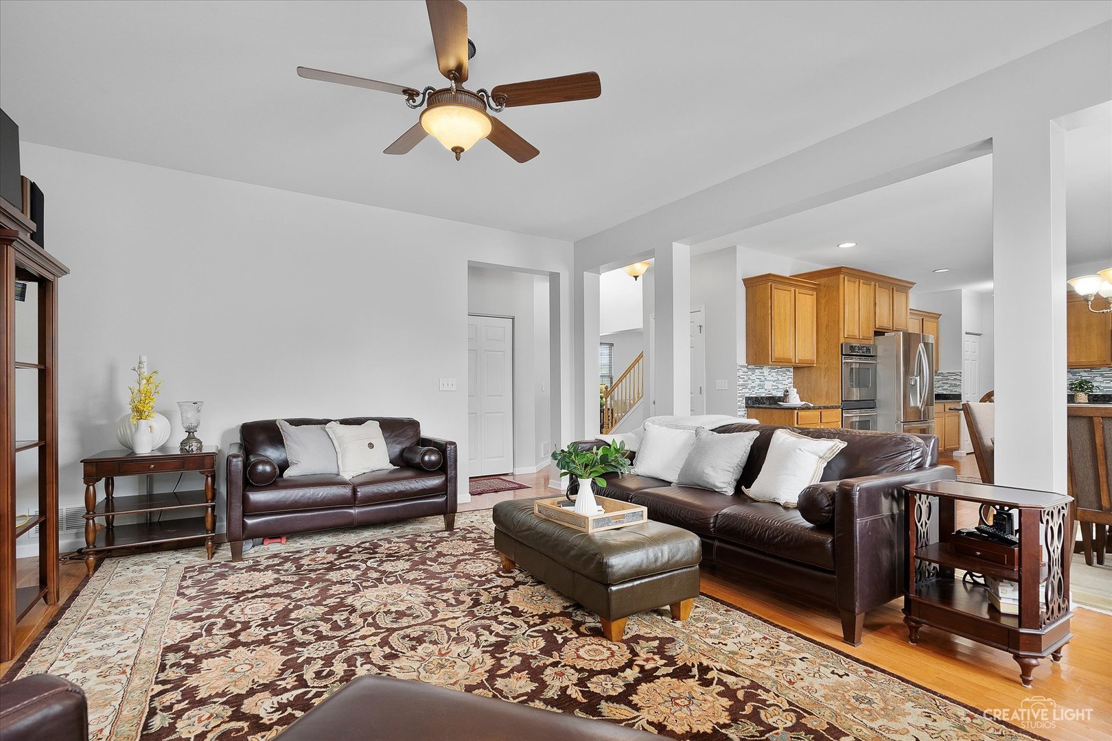 147 Gillett Street Sugar Grove, IL 60554 - Photo 18 of 32 a living room with furniture and a fireplace