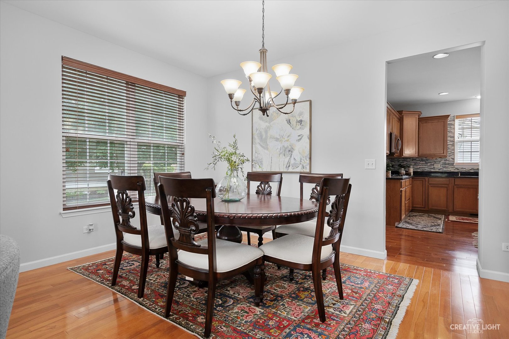 147 Gillett Street Sugar Grove, IL 60554 - Photo 19 of 32 a view of a dining room with furniture window and wooden floor