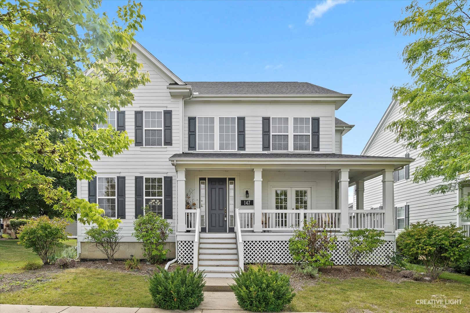 147 Gillett Street Sugar Grove, IL 60554 - Photo 2 of 32 a front view of a house with yard and green space