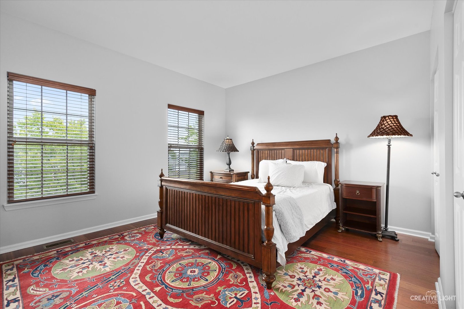147 Gillett Street Sugar Grove, IL 60554 - Photo 6 of 32 a bedroom with a bed and a lamp on dresser
