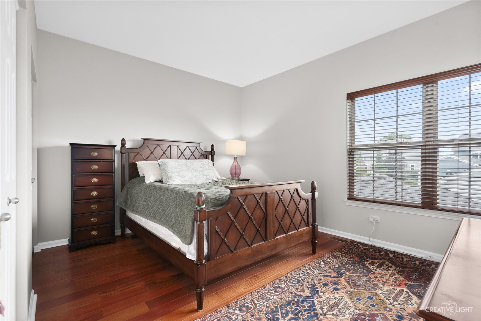 147 Gillett Street Sugar Grove, IL 60554 - Photo 10 of 32 a bedroom with a bed and a window