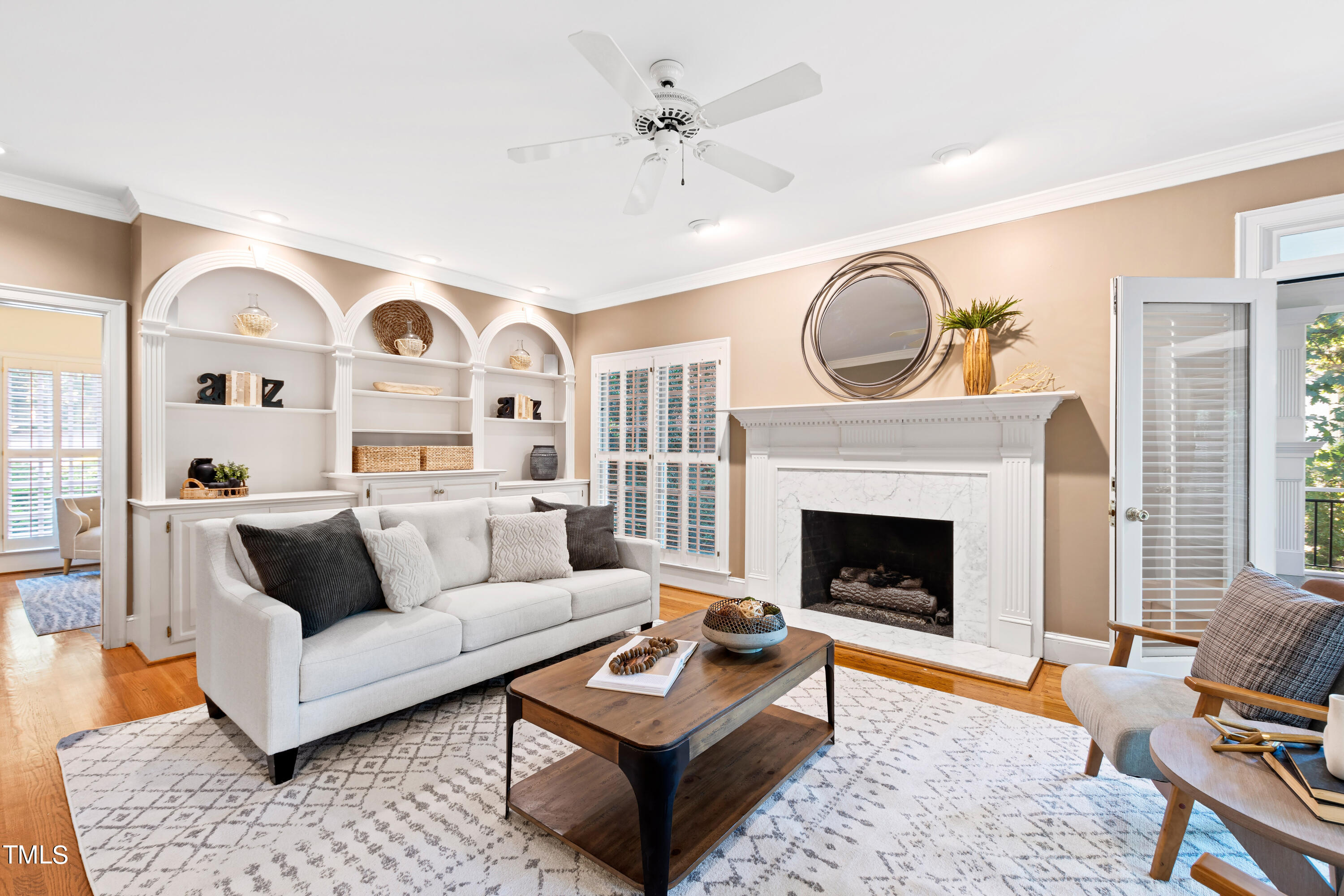 605 Chalfant Court Raleigh, NC 27607 - Photo 9 of 37 Spacious family room with built-ins and a gas fireplace