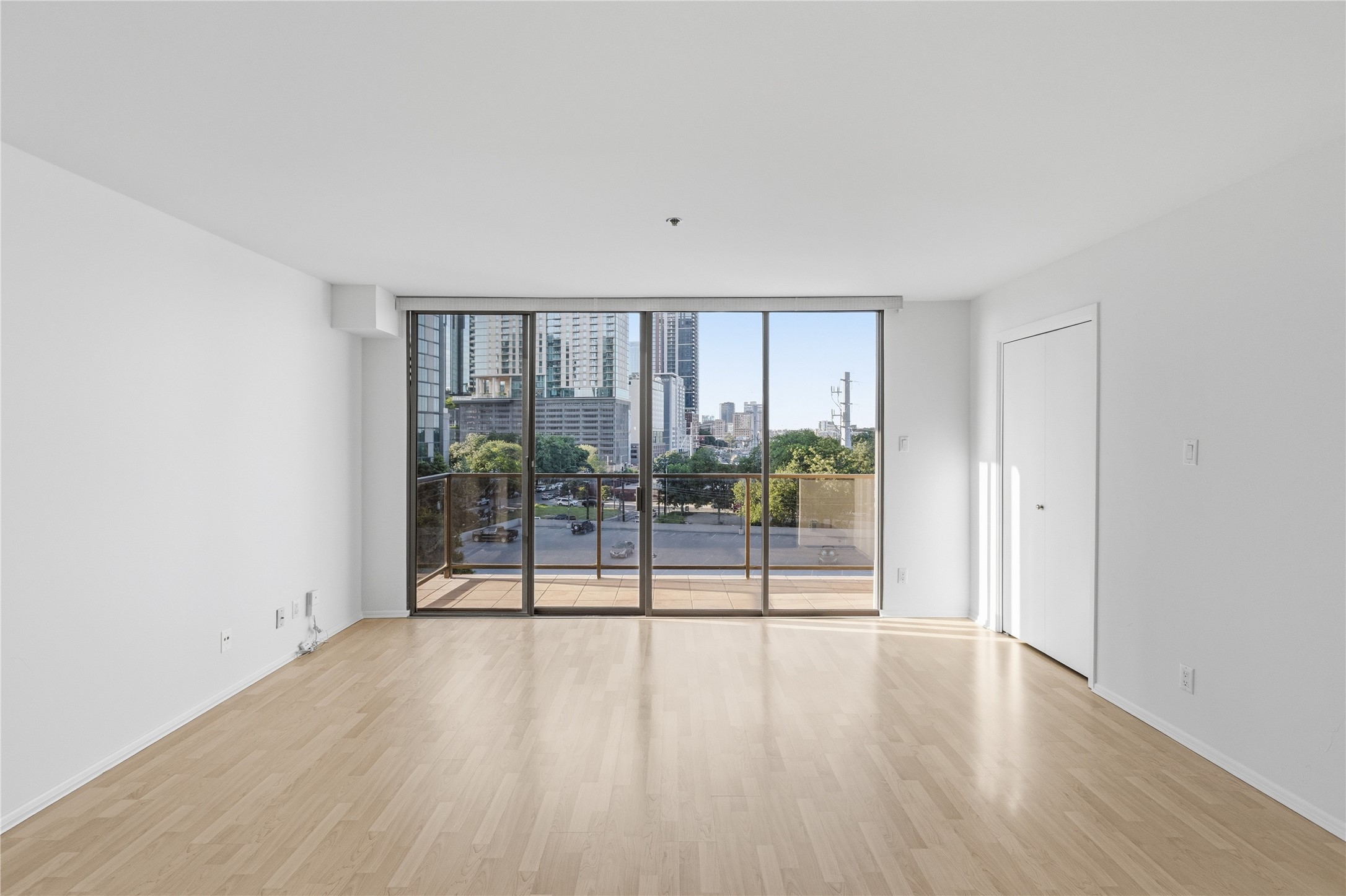40 North Interstate Highway 35, Unit 7B1 Austin, TX 78701 - Photo 2 of 21 Floor-to-ceiling glass doors offer expansive urban views and abundant natural light.