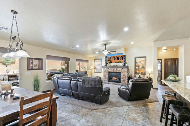 210 Talon Court Ivins, UT 84738 - Photo 14 of 60 Living room featuring a fireplace, ceiling fan, and recessed lighting
