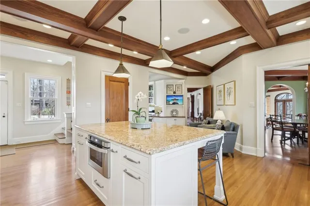a view of a dining table chairs and wooden floor