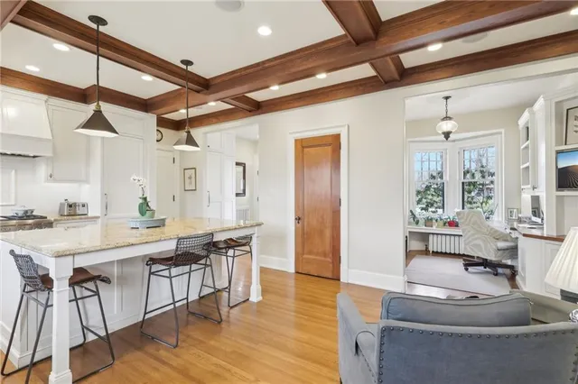 a kitchen with stainless steel appliances granite countertop a stove and a wooden floors