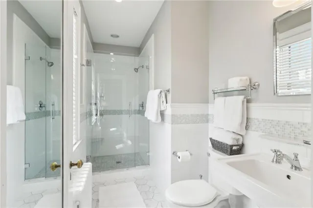 a bedroom with a bed a table and chair