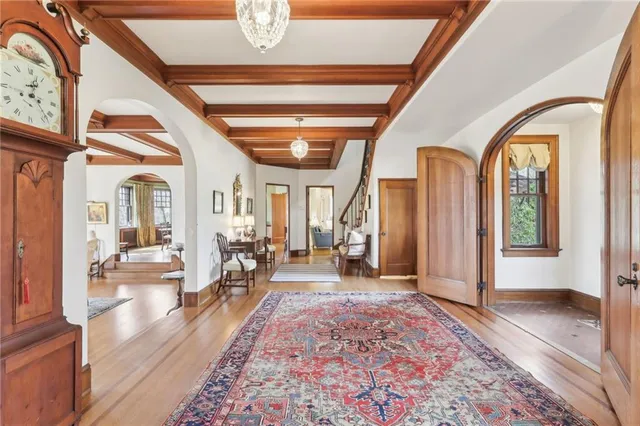 a very nice looking room with wooden floor and furniture