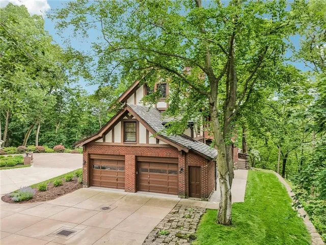 an aerial view of a house with yard swimming pool and outdoor seating