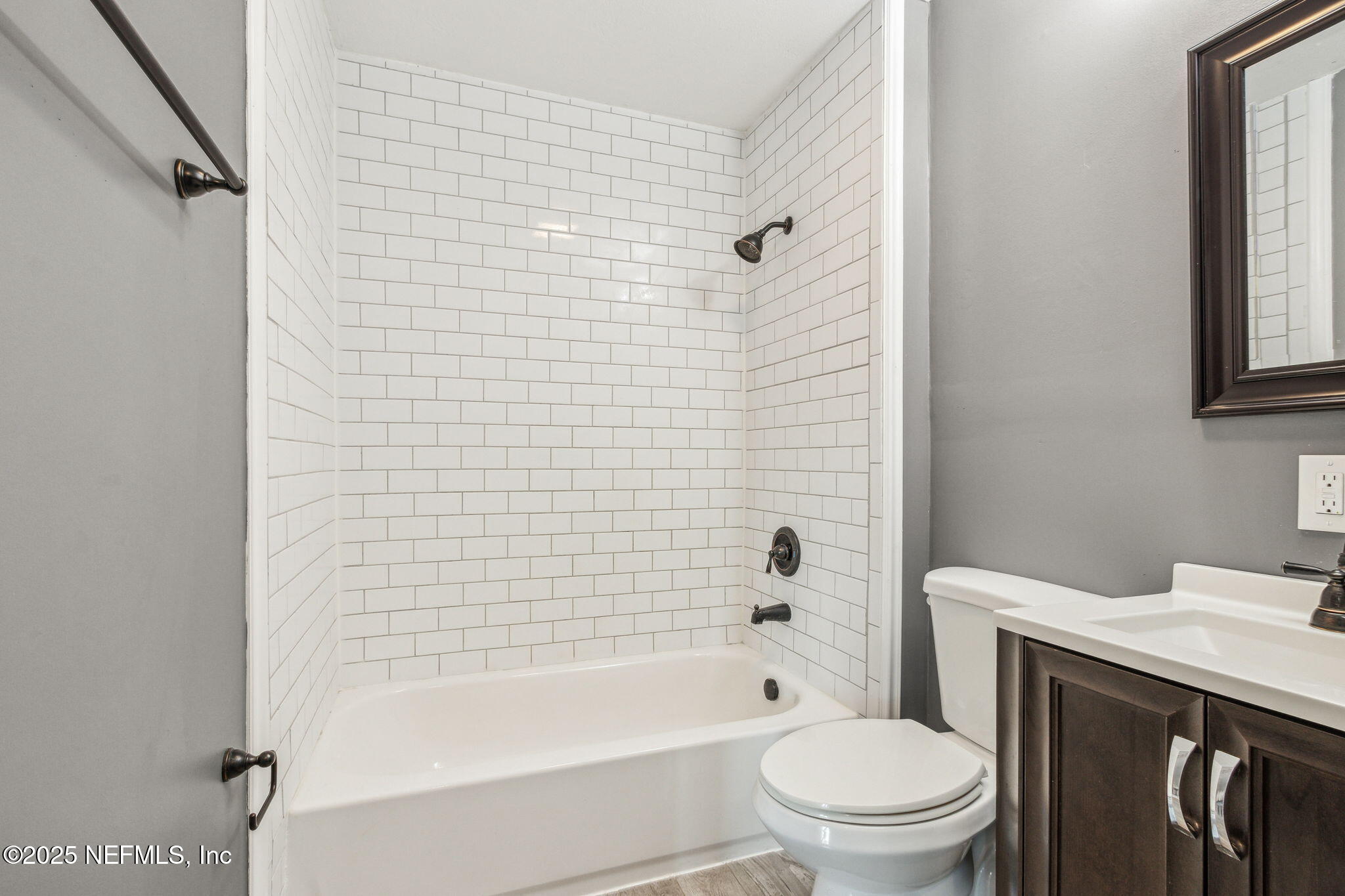 86221 Spring Meadow Avenue Yulee, FL 32097 - Photo 13 of 23 a bathroom with a bathtub shower sink vanity and toilet