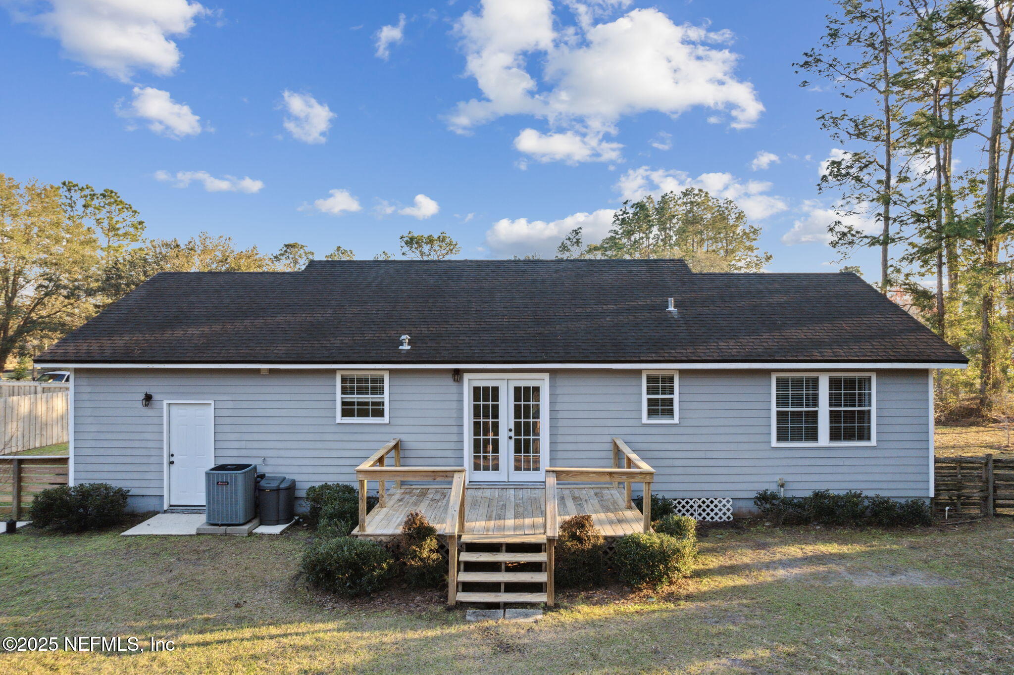 86221 Spring Meadow Avenue Yulee, FL 32097 - Photo 21 of 23 front view of a house with a yard