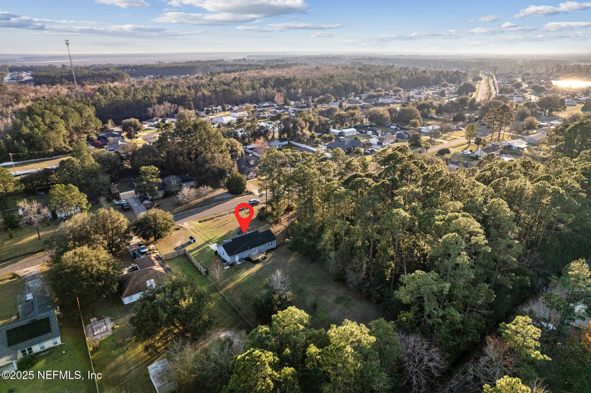 86221 Spring Meadow Avenue Yulee, FL 32097 - Photo 22 of 23 an aerial view of residential houses with city and ocean view