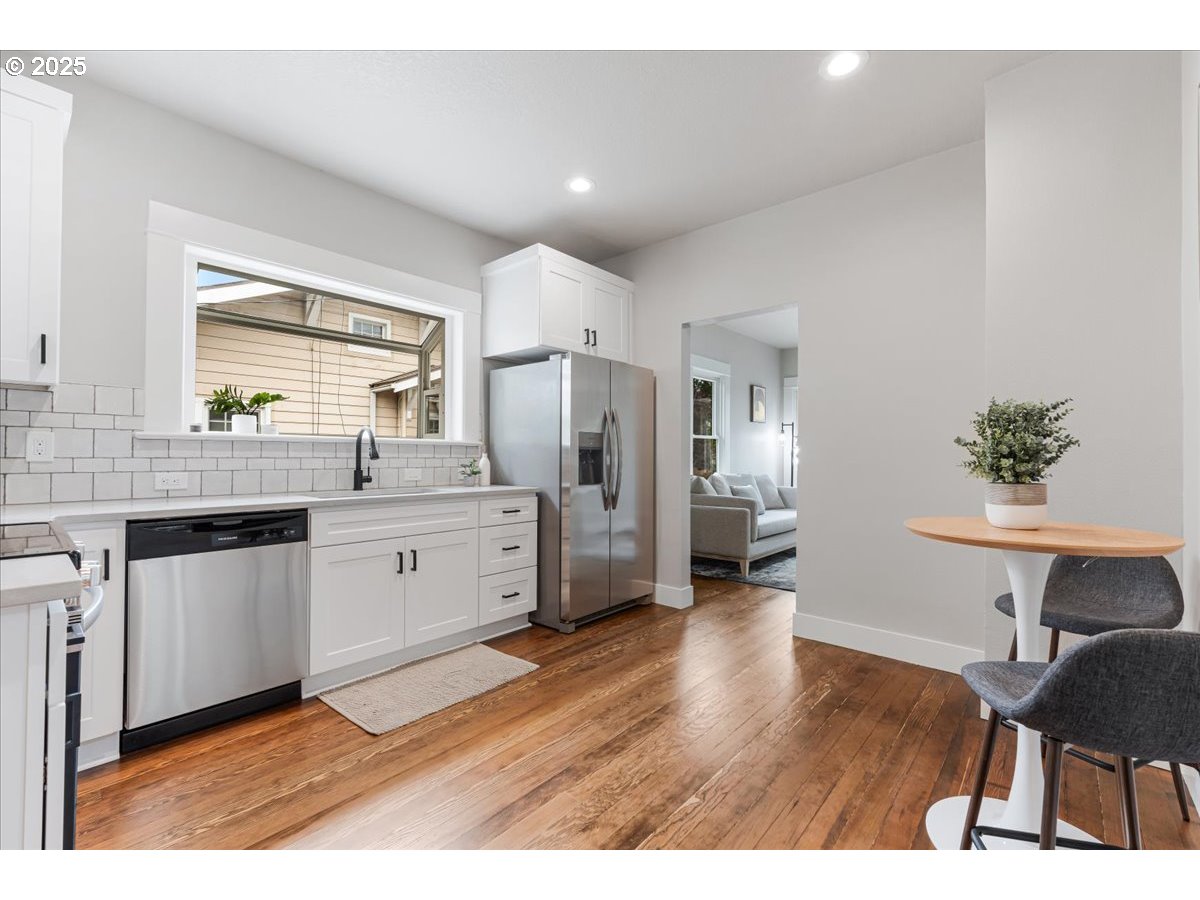 7216 North Ivanhoe Street Portland, OR 97203 - Photo 12 of 30 a kitchen with a refrigerator and a sink