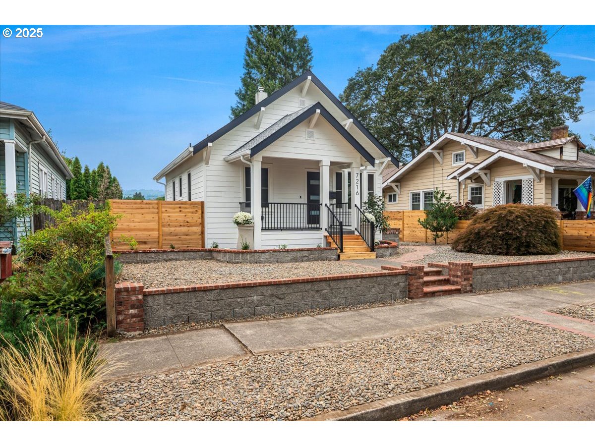 7216 North Ivanhoe Street Portland, OR 97203 - Photo 4 of 30 a front view of a house with a yard