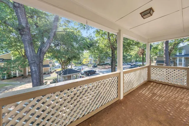 a view of a porch with wooden floor and outdoor space