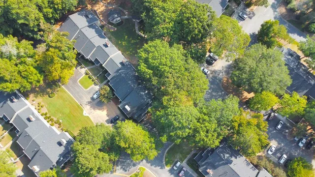 a aerial view of a residential apartment building with swimming pool