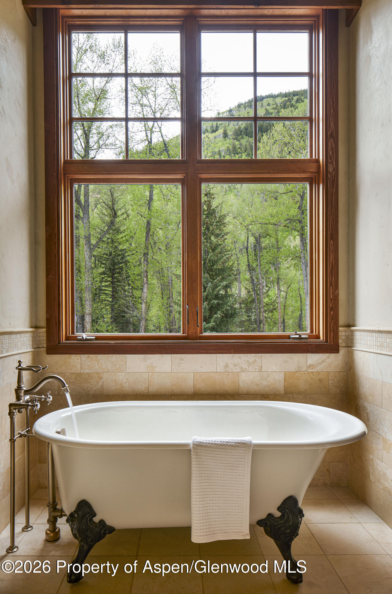 143 Conundrum Creek Road Aspen, CO 81611 - Photo 12 of 16 a bathroom with a bathtub and window