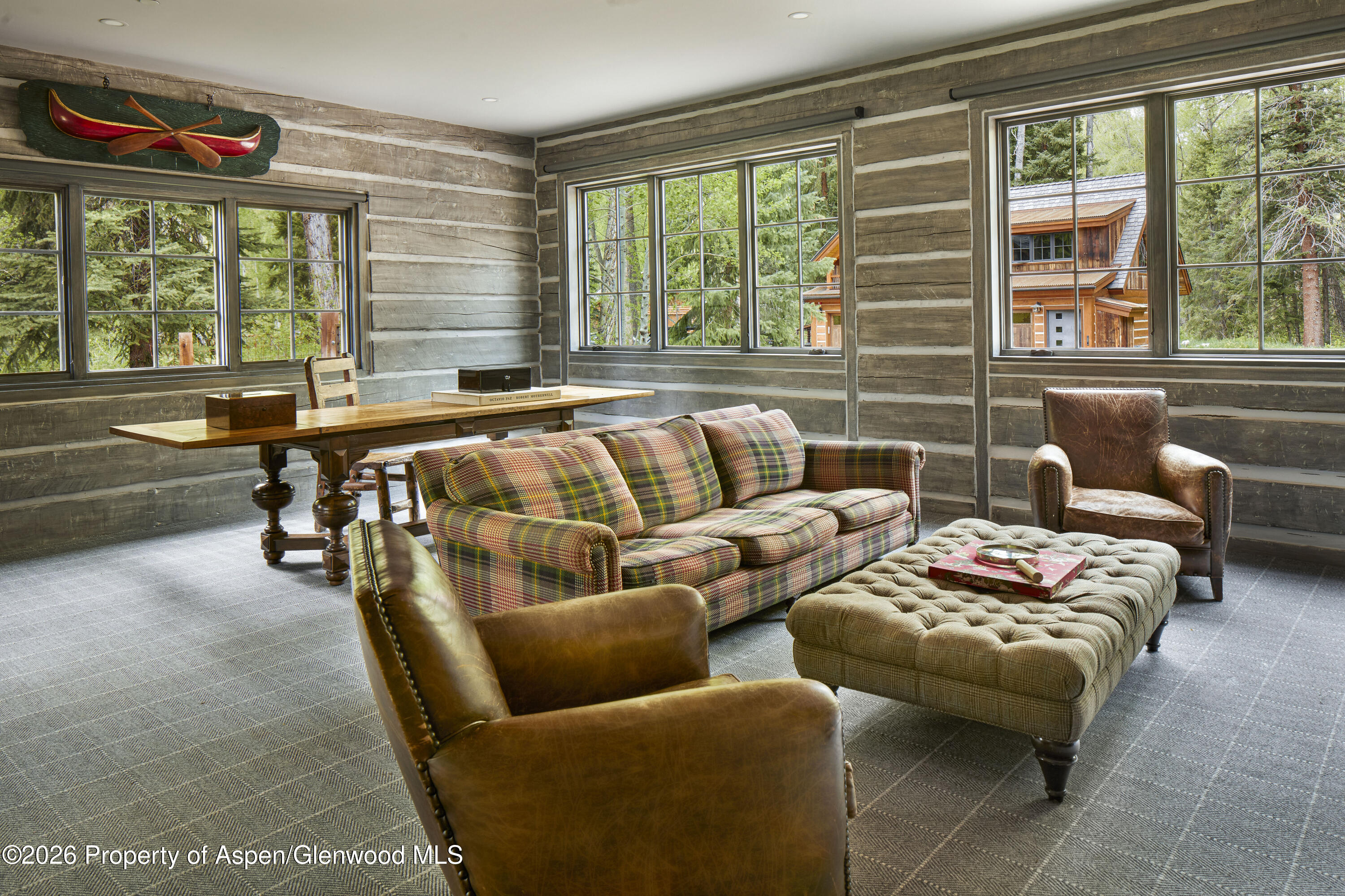 143 Conundrum Creek Road Aspen, CO 81611 - Photo 13 of 16 a living room with furniture and a large window